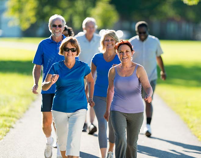 senior citizens walking outside