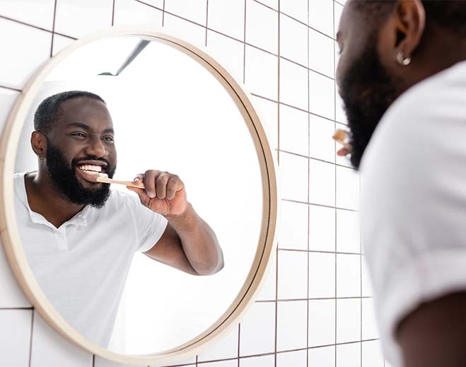 man brushing teeth